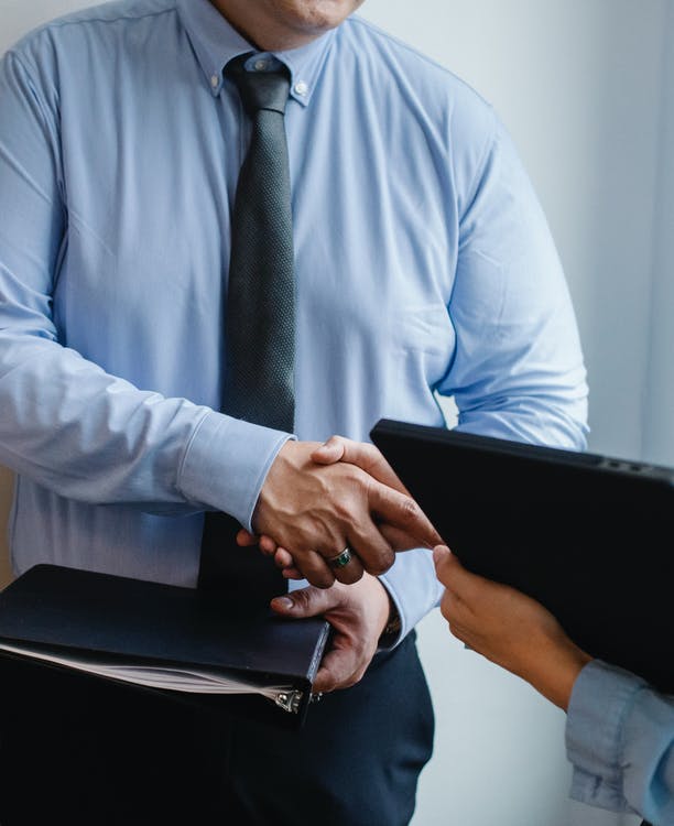 Man and women shaking hands